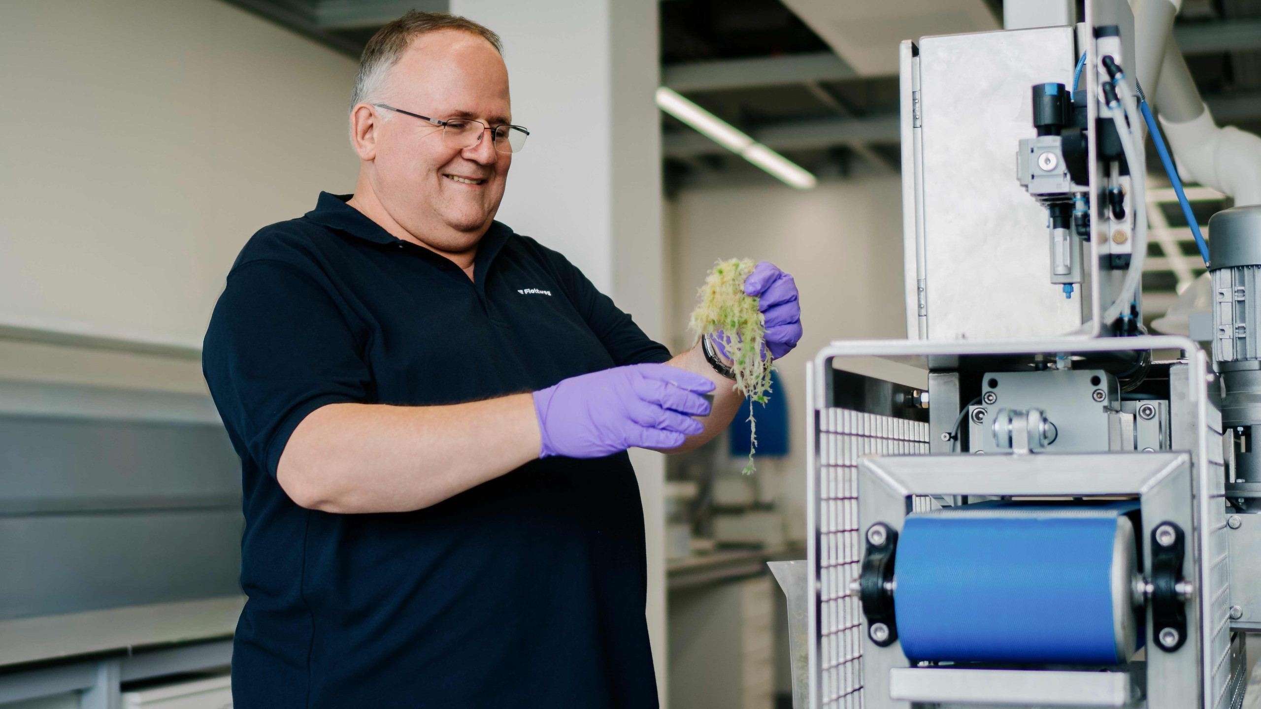 Conducting pressing tests using a laboratory belt press to determine optimal process parameters for continuous solid-liquid separation